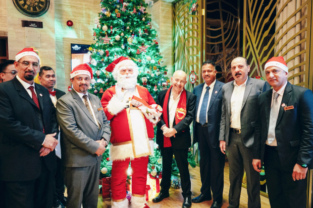 <p><em><strong>A candid moment with Santa</strong></em></p><p>The Savoy Grande Hotel Seef recently staged its Christmas tree lighting ceremony. The event, held at the property’s lobby, was attended by guests, nearby residents and the hotel’s management and staff members. Festive cheer set the tone for the evening with carol singing, a visit from Santa Claus and small bites.&nbsp;</p><div class="explain-selected-button explain-selected-circle"></div><style>
.explain-selected-button.explain-selected-text-selected-show-button {
  display: block !important;
}

.explain-selected-button.explain-selected-expanded {
  width: 400px;
  border: 0px;
  cursor: default; 
  height: 350px; 
  overflow: auto;
  box-shadow: rgba(15, 15, 15, 0.05) 0px 0px 0px 1px, rgba(15, 15, 15, 0.1) 0px 3px 6px, rgba(15, 15, 15, 0.2) 0px 9px 24px;
}

.explain-selected-button.explain-selected-circle:not(.explain-selected-expanded) {
  width: 35px;
  height: 35px;
  background: transparent;
  border-radius: 50%;
  opacity: 0.5;
}
.explain-selected-button.explain-selected-circle:not(.explain-selected-expanded):hover::before {
  content: "";
  position: absolute;
  width: 35px;
  height: 35px;
  background-color: rgba(128, 0, 128, 0.5);
  border-radius: 50%;
  top: 50%;
  left: 50%;
  transform: translate(-50%, -50%);
  animation: explain-selected-growAndFade 2.0s ease-in-out;
  animation-iteration-count: infinite;
}

.explain-selected-button.explain-selected-circle:not(.explain-selected-expanded)::after {
  content: "";
  position: absolute;
  width: 10px;
  height: 10px;
  background-color: rgb(128, 0, 128);
  top: 50%;
  left: 50%;
  transform: translate(-50%, -50%);
  border-radius: 50%;
}
.explain-selected-button.explain-selected-circle:not(.explain-selected-expanded):hover::after {
  width: 14px;
  height: 14px;
}

@keyframes explain-selected-growAndFade {
  0% {
    width: 10px;
    height: 10px;
    opacity: 1;
  }
  100% {
    width: 30px;
    height: 30px;
    opacity: 0;
  }
}

.explain-selected-button {
  display: none !important;
  width: 120px;
  height: 28px;
  border-radius: 4px;
  border: 0px;
  position: absolute;
  z-index: 9999;
  opacity: 1;
  cursor: pointer;
  background: white;
  text-align:left;
  font-family: Tahoma,Arial,Helvetica Neue,Helvetica,sans-serif; 
  background-color: #fff;
  color: #333;
}

.swal2-icon-show-explainselected {
  border: none;
}

.swal2-container p {
  margin: 0 !important;
}

</style>